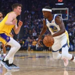 Golden State Warriors’ Jimmy Butler III (10) drives past Los Angeles Lakers’ Dalton Knecht (4)