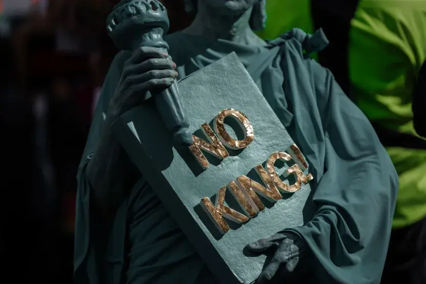 A protester dressed in a Statue of Liberty costume takes part in a protest in New York on Saturday.