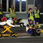 Emergency workers standby at Bondi Beach after a reported shooting in Sydney, Sunday, Dec. 14, 2025.